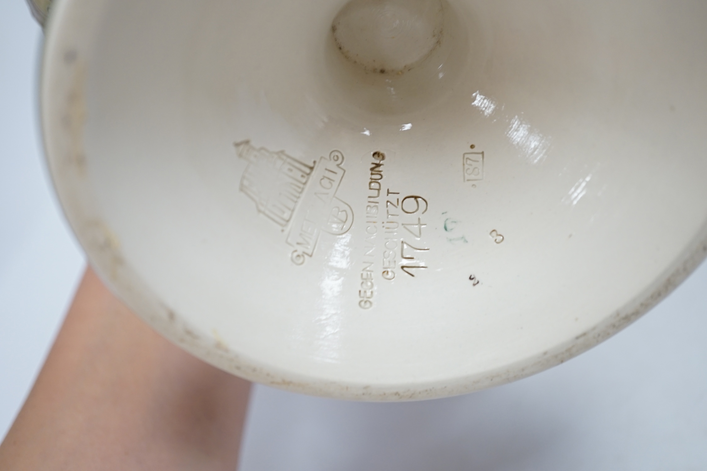 A Mettlach stoneware oil lamp and a similar Mettlach vase, largest 58cm high. Condition - good